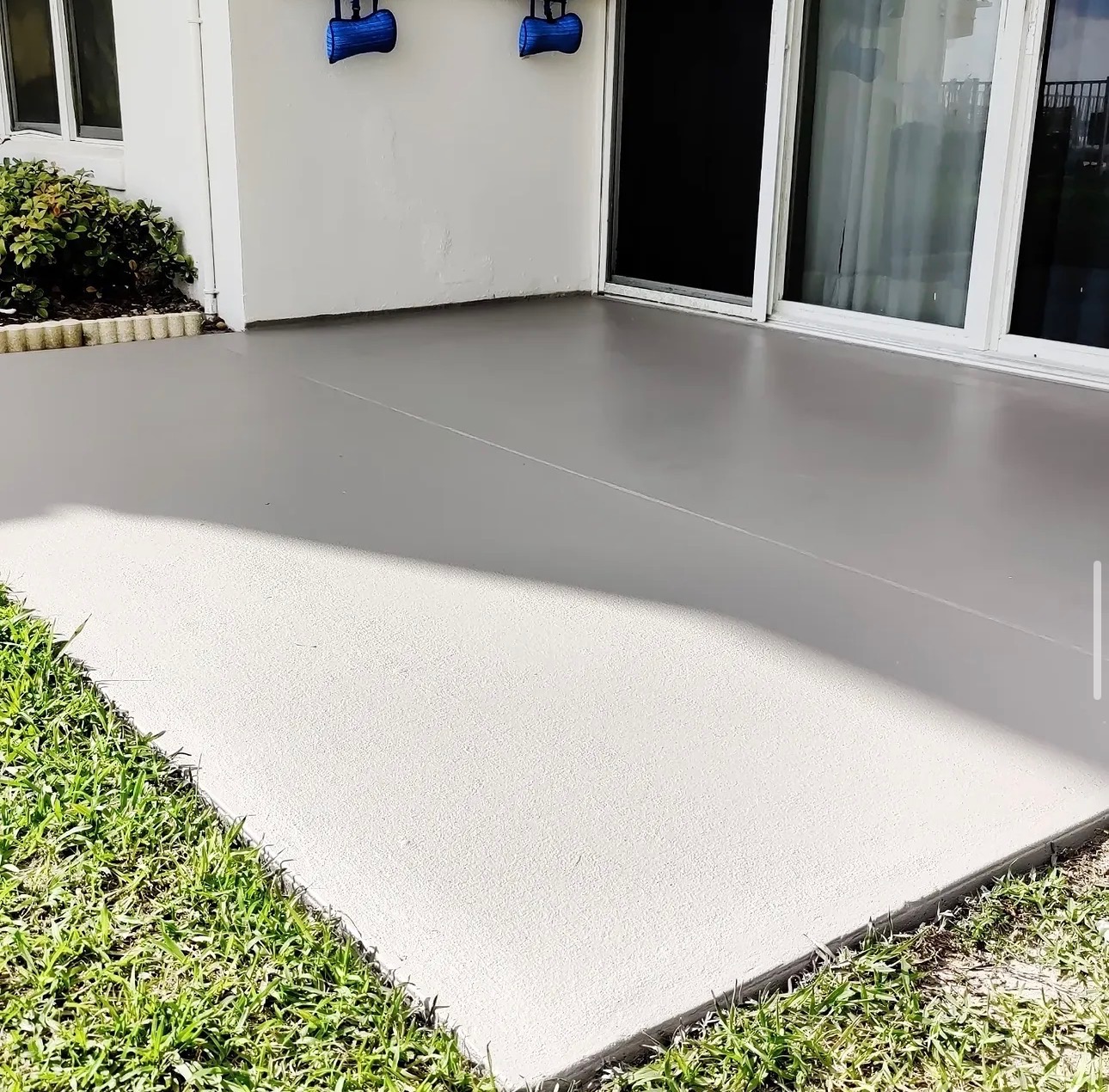 Same concrete patio freshly coated in smooth warm gray